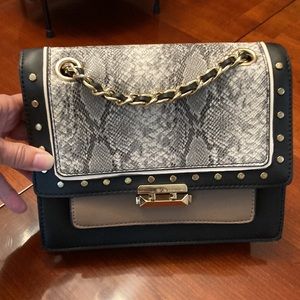 BCBGeneration purse.NWOT. Gorgeous handbag. Snake skin front. Taupe and black.